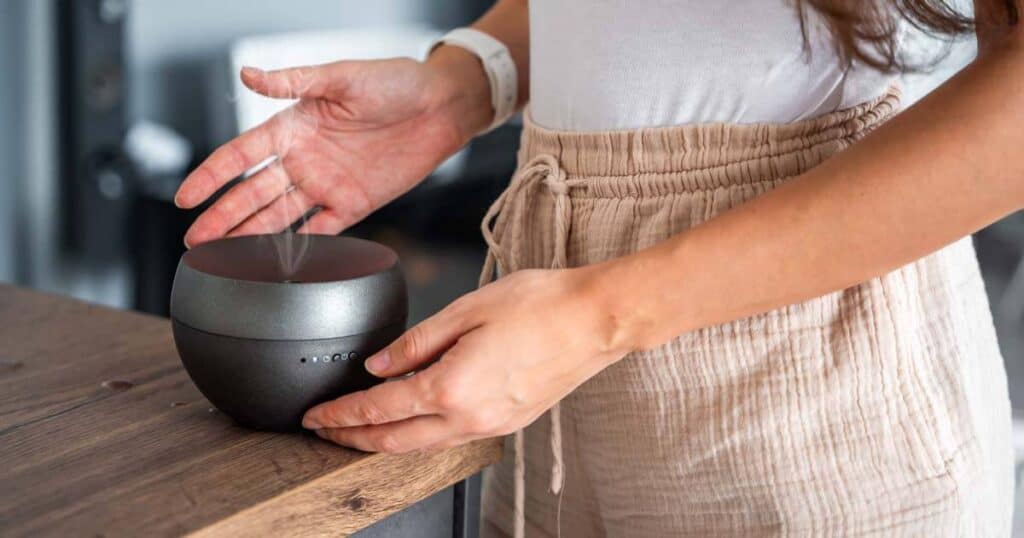 lady checking her smart essential oil diffuser