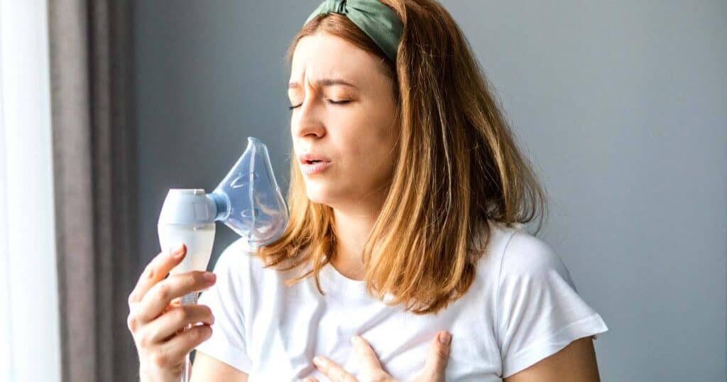 lady using nebulizer for her asthma