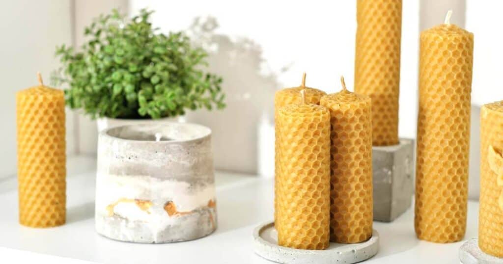 The 10 Healthiest Ways to Fragrance Your Home: A 2026 Guide 22 beeswax candles on a shelf