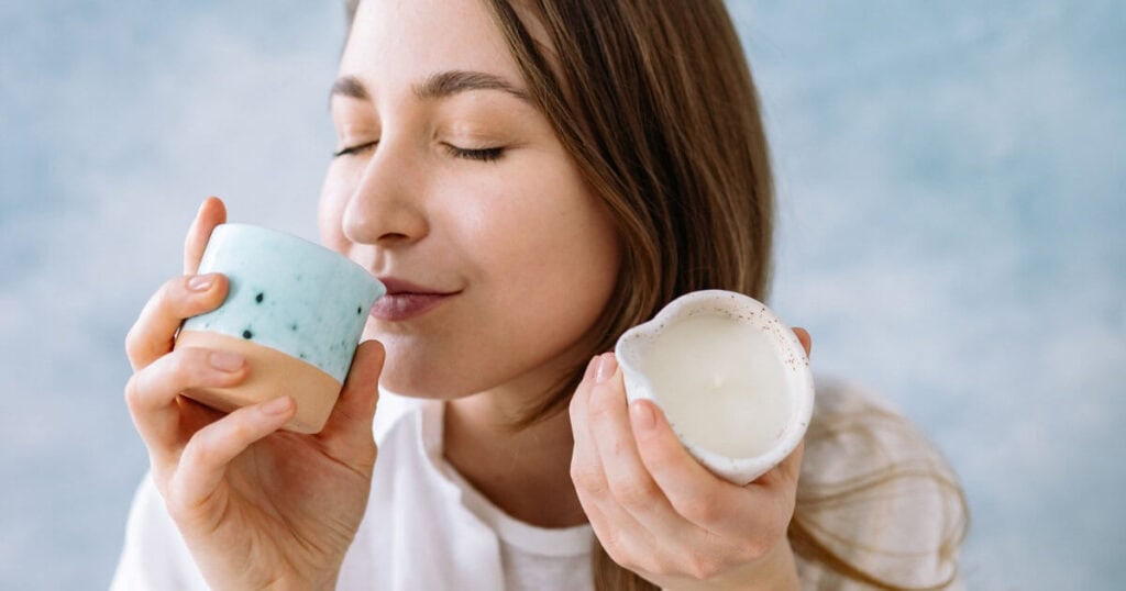 lady smelling candle