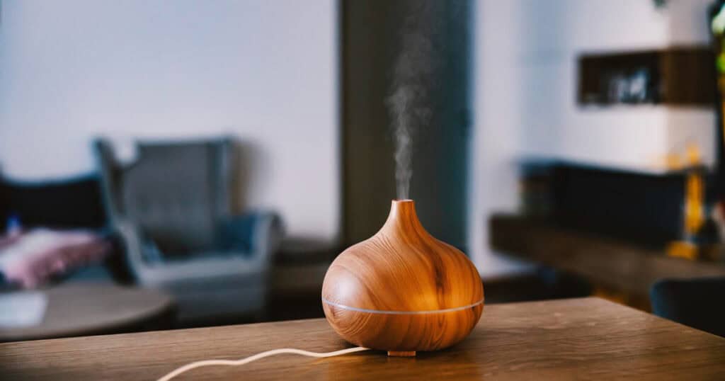 12 Best Low-Maintenance Diffusers for Daily Use at Home 25 wooden essential oil diffuser in top of the wooden table